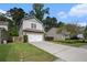 Charming two-story home featuring a two-car garage and well-maintained lawn at 1723 Indaba Way, Charleston, SC 29414