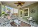 Charming screened porch offers peaceful outdoor living with comfortable seating and backyard access at 1723 Indaba Way, Charleston, SC 29414