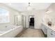 Luxurious bathroom with soaking tub, glass shower, and double vanity at 1749 James Basford Pl, Mount Pleasant, SC 29466