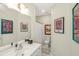 Bathroom with a single vanity, marble countertop, framed art and a shower behind a curtain at 1749 James Basford Pl, Mount Pleasant, SC 29466