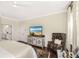 Comfortable bedroom offers a window view, neutral colors, and hardwood floors at 1749 James Basford Pl, Mount Pleasant, SC 29466