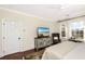 Comfortable bedroom offers a window view, neutral colors, and hardwood floors at 1749 James Basford Pl, Mount Pleasant, SC 29466