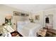 Comfortable bedroom with bright windows, neutral colors, and hardwood floors at 1749 James Basford Pl, Mount Pleasant, SC 29466