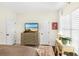 Bright bedroom featuring a dresser with a TV and large window for natural light at 1749 James Basford Pl, Mount Pleasant, SC 29466