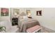Nicely decorated bedroom with a quilted bed, accent chair, and vintage style vanity at 1749 James Basford Pl, Mount Pleasant, SC 29466