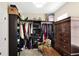 Walk-in closet with custom shelving, ample storage, and unique decor at 1749 James Basford Pl, Mount Pleasant, SC 29466