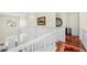 Bright foyer features white trim, hardwood floors, and a view of the front door and chandelier at 1749 James Basford Pl, Mount Pleasant, SC 29466