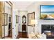 Hallway with hardwood floors, decorative mirrors and a view of the living room at 1749 James Basford Pl, Mount Pleasant, SC 29466