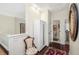 Hallway boasts hardwood floors, white trim, and access to the bathroom, giving a clean and elegant feel at 1749 James Basford Pl, Mount Pleasant, SC 29466
