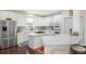 Well-lit kitchen with white cabinets, stainless steel appliances and center island at 1749 James Basford Pl, Mount Pleasant, SC 29466