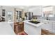 Updated kitchen with a view to the porch featuring white cabinets and stainless steel appliances at 1749 James Basford Pl, Mount Pleasant, SC 29466