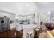 Modern kitchen features white cabinetry, stainless appliances, and an island with seating at 1749 James Basford Pl, Mount Pleasant, SC 29466