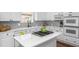 Bright, spacious kitchen with stainless steel appliances and gas cooktop on center island at 1749 James Basford Pl, Mount Pleasant, SC 29466