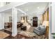 Inviting living room featuring coffered ceilings, elegant furnishings, and beautiful hardwood floors at 1749 James Basford Pl, Mount Pleasant, SC 29466