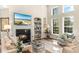 Cozy living room features a fireplace, built-in bookcase, and lots of natural light at 1749 James Basford Pl, Mount Pleasant, SC 29466