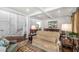 Comfortable living room featuring an open floor plan with views of the staircase and dining room at 1749 James Basford Pl, Mount Pleasant, SC 29466