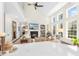 Bright and airy living room with tall windows, vaulted ceilings, and a fireplace at 1749 James Basford Pl, Mount Pleasant, SC 29466