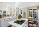 Bright and airy living room with tall windows, vaulted ceilings, and a fireplace at 1749 James Basford Pl, Mount Pleasant, SC 29466