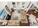 Spacious living room offers a fireplace, custom built-ins, hardwood flooring, and plenty of natural light at 1749 James Basford Pl, Mount Pleasant, SC 29466