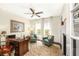 Bright office with a desk, two chairs and a view of the backyard at 1749 James Basford Pl, Mount Pleasant, SC 29466