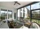 Relaxing screened porch with cozy furniture and view of the backyard at 1749 James Basford Pl, Mount Pleasant, SC 29466
