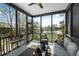 Inviting screened-in porch with lake views, perfect for relaxing and enjoying the outdoors at 1749 James Basford Pl, Mount Pleasant, SC 29466