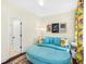 Sitting room with a comfortable blue couch and access to a bathroom, offering convenience and style at 1749 James Basford Pl, Mount Pleasant, SC 29466