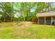 The backyard includes a wooden storage shed and mature trees at 1785 N Mayflower Dr, Charleston, SC 29412