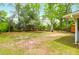 Large backyard with shed and mature trees offering ample space at 1785 N Mayflower Dr, Charleston, SC 29412