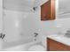 Bathroom with white tile, vanity, and tub-shower combination at 1785 N Mayflower Dr, Charleston, SC 29412