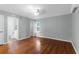 Bright bedroom featuring hardwood floors, ensuite bathroom, and lots of natural light at 1785 N Mayflower Dr, Charleston, SC 29412