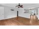 Open concept living room with hardwood floors, stylish ceiling fan, and access to the patio at 1785 N Mayflower Dr, Charleston, SC 29412