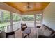 Relax on the screened porch featuring a ceiling fan and backyard views at 1785 N Mayflower Dr, Charleston, SC 29412
