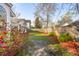 Spacious backyard featuring vibrant azaleas and a well-maintained lawn at 1906 Cedar Petal Ln, Charleston, SC 29414