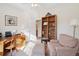 Inviting bedroom featuring chair, ottoman, built-in shelving, and ample natural light at 1906 Cedar Petal Ln, Charleston, SC 29414