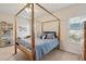 Serene bedroom with a canopy bed, blue bedding, and cozy ambiance at 1906 Cedar Petal Ln, Charleston, SC 29414