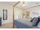 Bright bedroom featuring a four-poster bed with blue bedding and matching decor at 1906 Cedar Petal Ln, Charleston, SC 29414