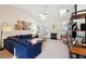 Bright living room with vaulted ceilings, a fireplace, skylights, and comfortable seating arrangements at 1906 Cedar Petal Ln, Charleston, SC 29414