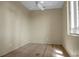 Well-lit bedroom with wood floors, neutral walls, a window, and a ceiling fan at 2 Leone Ln, Hanahan, SC 29410