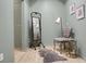 Bedroom with wood floors, a full-length mirror, and soft chair at 2 Leone Ln, Hanahan, SC 29410