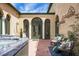 Charming outdoor courtyard with hot tub and lounge chairs, ideal for enjoying the sun at 2 Leone Ln, Hanahan, SC 29410