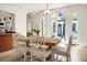 Bright dining room with a wooden table, seating for six, and views to the courtyard at 2 Leone Ln, Hanahan, SC 29410