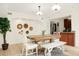 Elegant dining room features modern accents, a wooden table, and ample natural light at 2 Leone Ln, Hanahan, SC 29410