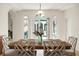 Dining room highlighting a wooden table, seating for six, and courtyard views at 2 Leone Ln, Hanahan, SC 29410