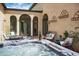 Inviting courtyard with a hot tub, perfect for relaxation and entertaining guests with a glass of wine at 2 Leone Ln, Hanahan, SC 29410