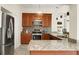 Stylish kitchen features stainless steel appliances, granite countertops, and a mosaic backsplash at 2 Leone Ln, Hanahan, SC 29410