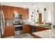 Modern kitchen showcasing stainless steel appliances, granite countertops, and custom cabinetry at 2 Leone Ln, Hanahan, SC 29410