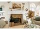 Living room featuring a fireplace, archway entrances, and hardwood floors at 2 Leone Ln, Hanahan, SC 29410