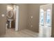 Bright living room with wood floors, and an adjacent bathroom at 2 Leone Ln, Hanahan, SC 29410