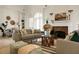 Cozy living room featuring a fireplace, archway entrances, and hardwood floors at 2 Leone Ln, Hanahan, SC 29410